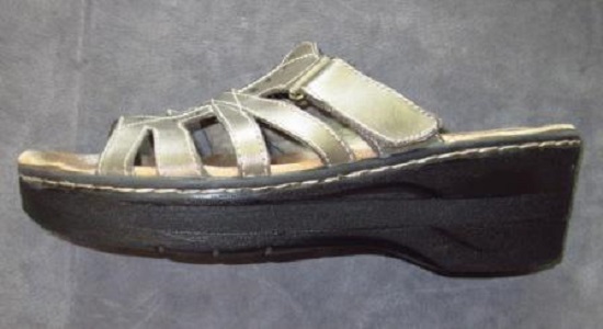Orthopedic shoe adjustment for shorter leg