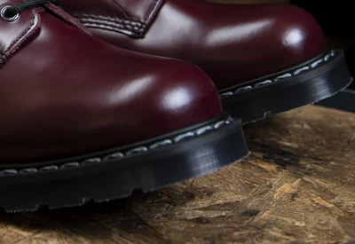 Dr. Marten boots with smooth-edge replacement soles after resoling